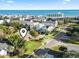 Aerial view of the community, beach, and ocean view on a sunny day at 210 16Th Ave. N, Surfside Beach, SC 29575