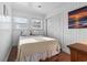 Comfortable bedroom featuring a queen bed, closet, and natural light from two windows at 210 16Th Ave. N, Surfside Beach, SC 29575