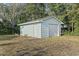Detached garage with two doors is on a grassy lot at 210 16Th Ave. N, Surfside Beach, SC 29575