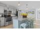 Well-equipped kitchen with island, beverage cooler, seating, granite countertops, and ample storage at 210 16Th Ave. N, Surfside Beach, SC 29575