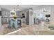 Open kitchen with island, beverage cooler, stainless steel appliances, and view to living area at 210 16Th Ave. N, Surfside Beach, SC 29575