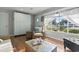 Comfortable living room featuring a large window with sheer curtains and views of the neighborhood at 210 16Th Ave. N, Surfside Beach, SC 29575