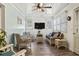 Cozy coastal living room with wicker furniture and a ceiling fan for a relaxing atmosphere at 210 16Th Ave. N, Surfside Beach, SC 29575