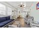 Comfortable sunroom featuring wicker furniture, hardwood floors, and a ceiling fan at 210 16Th Ave. N, Surfside Beach, SC 29575