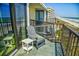 Oceanfront condo balcony with Adirondack chairs offers stunning views of the beach and the ocean at 2101 S Ocean Blvd. S # B-6, North Myrtle Beach, SC 29582