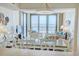 Bright dining room with ocean view and sliding door to the balcony with modern furnishings and decor at 2101 S Ocean Blvd. S # B-6, North Myrtle Beach, SC 29582