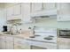 Modern kitchen with ample counter space and white appliances, ready for culinary adventures at 2101 S Ocean Blvd. S # B-6, North Myrtle Beach, SC 29582