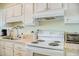 Functional kitchen with white cabinetry and modern appliances at 2101 S Ocean Blvd. S # B-6, North Myrtle Beach, SC 29582