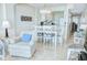 Inviting living space with dining area and white kitchen, creating an open and airy atmosphere at 2101 S Ocean Blvd. S # B-6, North Myrtle Beach, SC 29582