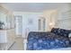 Bright main bedroom with a dresser, mirror, and doorway to the en-suite bathroom at 2101 S Ocean Blvd. S # B-6, North Myrtle Beach, SC 29582