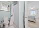 Clean bathroom with a toilet, shower, and view of the bedroom at 214 Landing Rd. # I, North Myrtle Beach, SC 29582