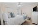 Serene bedroom with a king bed, dresser with TV, and a wardrobe at 214 Landing Rd. # I, North Myrtle Beach, SC 29582