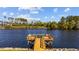 Wooden dock extends into the waterway with scenic views of the surrounding landscape at 214 Landing Rd. # I, North Myrtle Beach, SC 29582