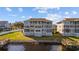 Rear condo view features multiple balconies overlooking the waterfront with private docks at 214 Landing Rd. # I, North Myrtle Beach, SC 29582