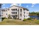 Condo building exterior with balconies, well-manicured landscaping, and views of the waterfront at 214 Landing Rd. # I, North Myrtle Beach, SC 29582