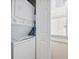 Laundry room showcasing a stacked washer and dryer unit at 214 Landing Rd. # I, North Myrtle Beach, SC 29582
