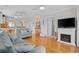 Cozy living room with hardwood floors, a fireplace, and a comfortable sofa at 214 Landing Rd. # I, North Myrtle Beach, SC 29582
