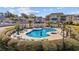 Community pool area with ample seating, lounge chairs, and a clubhouse at 214 Landing Rd. # I, North Myrtle Beach, SC 29582