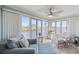 Bright sunroom with waterfront views features cozy seating and lots of natural light at 214 Landing Rd. # I, North Myrtle Beach, SC 29582