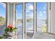 Stunning waterfront view is framed by sunroom windows, offering peaceful scenery and natural light at 214 Landing Rd. # I, North Myrtle Beach, SC 29582