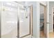 Bathroom featuring a glass shower with tiled walls and an entrance leading to the toilet and sink at 230 Palmetto Green Dr., Longs, SC 29568