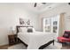 Bedroom featuring a queen bed with white linens, dark wood furniture, and natural light from a window at 230 Palmetto Green Dr., Longs, SC 29568
