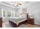 Serene primary bedroom with hardwood floors, tray ceiling and ample natural light at 230 Palmetto Green Dr., Longs, SC 29568