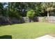 Large, grassy backyard enclosed by a wooden fence at 2429 Westbrook Dr., Conway, SC 29527