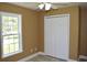 Bedroom with a window and double door closet offering additional storage at 2429 Westbrook Dr., Conway, SC 29527