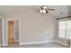 Spacious bedroom with ceiling fan, neutral paint, and new laminate flooring at 2429 Westbrook Dr., Conway, SC 29527