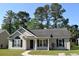 Lovely one-story home featuring a welcoming front porch and black shutters at 2429 Westbrook Dr., Conway, SC 29527