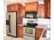 Well-equipped kitchen with stainless steel appliances and solid wood cabinets at 2429 Westbrook Dr., Conway, SC 29527