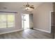 Bright living room with vaulted ceiling, neutral paint, and new laminate flooring at 2429 Westbrook Dr., Conway, SC 29527