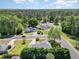 A high angle view shows the landscape and neighboring houses with manicured lawns and mature trees at 2654 Wild Game Trail, Myrtle Beach, SC 29588