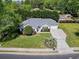 Aerial view of a well maintained house showing a long driveway, established landscaping and mature trees at 2654 Wild Game Trail, Myrtle Beach, SC 29588