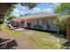 Spacious backyard with a patio set, colorful flowers, and a well-maintained lawn at 2654 Wild Game Trail, Myrtle Beach, SC 29588