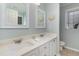 Bathroom featuring double sinks with a neutral-toned vanity, framed mirrors, and tile floors at 2654 Wild Game Trail, Myrtle Beach, SC 29588