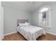 Cozy bedroom with a decorative window, ceiling fan, and light-colored walls at 2654 Wild Game Trail, Myrtle Beach, SC 29588