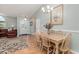 Charming dining area with ample seating, a decorative chandelier, and warm, inviting decor at 2654 Wild Game Trail, Myrtle Beach, SC 29588