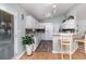 Bright kitchen featuring white cabinets, granite countertops, mosaic backsplash, and stainless steel appliances at 2654 Wild Game Trail, Myrtle Beach, SC 29588