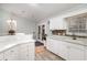 Kitchen featuring white cabinets, granite countertops, mosaic backsplash, breakfast bar, and stainless steel appliances at 2654 Wild Game Trail, Myrtle Beach, SC 29588