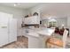 Stylish kitchen with modern appliances, granite countertops, and a breakfast bar at 2654 Wild Game Trail, Myrtle Beach, SC 29588