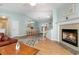 Open-concept living area with a cozy fireplace and views into the dining area at 2654 Wild Game Trail, Myrtle Beach, SC 29588