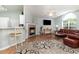 Cozy living room with a fireplace, comfortable seating, and abundant natural light at 2654 Wild Game Trail, Myrtle Beach, SC 29588