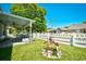 Backyard features a covered patio, white picket fence, and landscaped garden area at 2705 South Key Largo Circle, Myrtle Beach, SC 29577