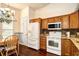 Traditional kitchen featuring wooden cabinets, granite countertops, and stainless steel appliances at 2705 South Key Largo Circle, Myrtle Beach, SC 29577
