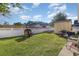 Fenced backyard with well-maintained grass, outdoor playhouse, storage shed and lounge area at 3012 Sabal Ct., Murrells Inlet, SC 29576