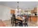 Cozy dining room adjacent to kitchen and laundry room with a classic chandelier at 3012 Sabal Ct., Murrells Inlet, SC 29576