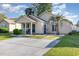 Charming single-story home featuring a well-manicured lawn, covered porch, and ample parking space in the driveway at 3012 Sabal Ct., Murrells Inlet, SC 29576