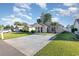 Inviting single-story home with a concrete driveway, lush green lawn, and charming curb appeal at 3012 Sabal Ct., Murrells Inlet, SC 29576